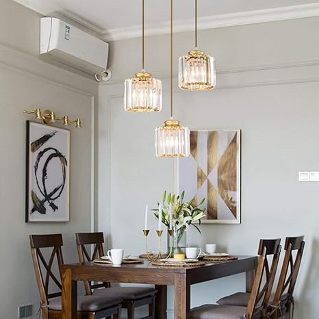 three pendant lights over dining table