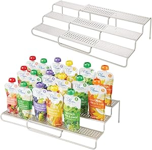 mDesign Expandable Kitchen Cabinet Metal Wire Kid/Baby Food Storage Shelf Organizer Rack Holder - for Pouches, Jars, Bottles, Formula, Juice Boxes - 3 Level Storage, Up to 25