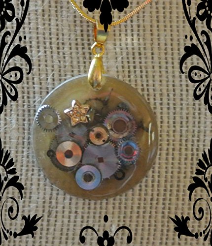 Cogs in Space- Round watch crystal with watch parts and star charm in warm brown on gold color chain.