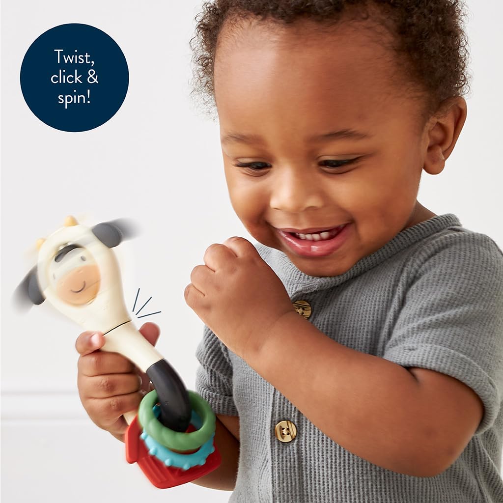 Itzy Ritzy Spinner Rattle Toy – Cow Design Sensory Teething Rattle Includes Spinning Face, Clicks, Rattles & Textured Teethers; Designed for Ages 3 Months and Up (Cow)