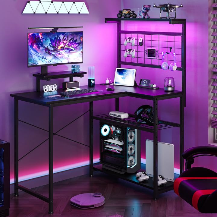 Photo 1 of OtterOasis L Shaped Gaming Desk, Reversible Computer Desk with 4-Tier Shelves, Corner Desk with Pegboard, Home Office Desk with LED Lights & Power Outlets Gaming Desk with Storage, Black