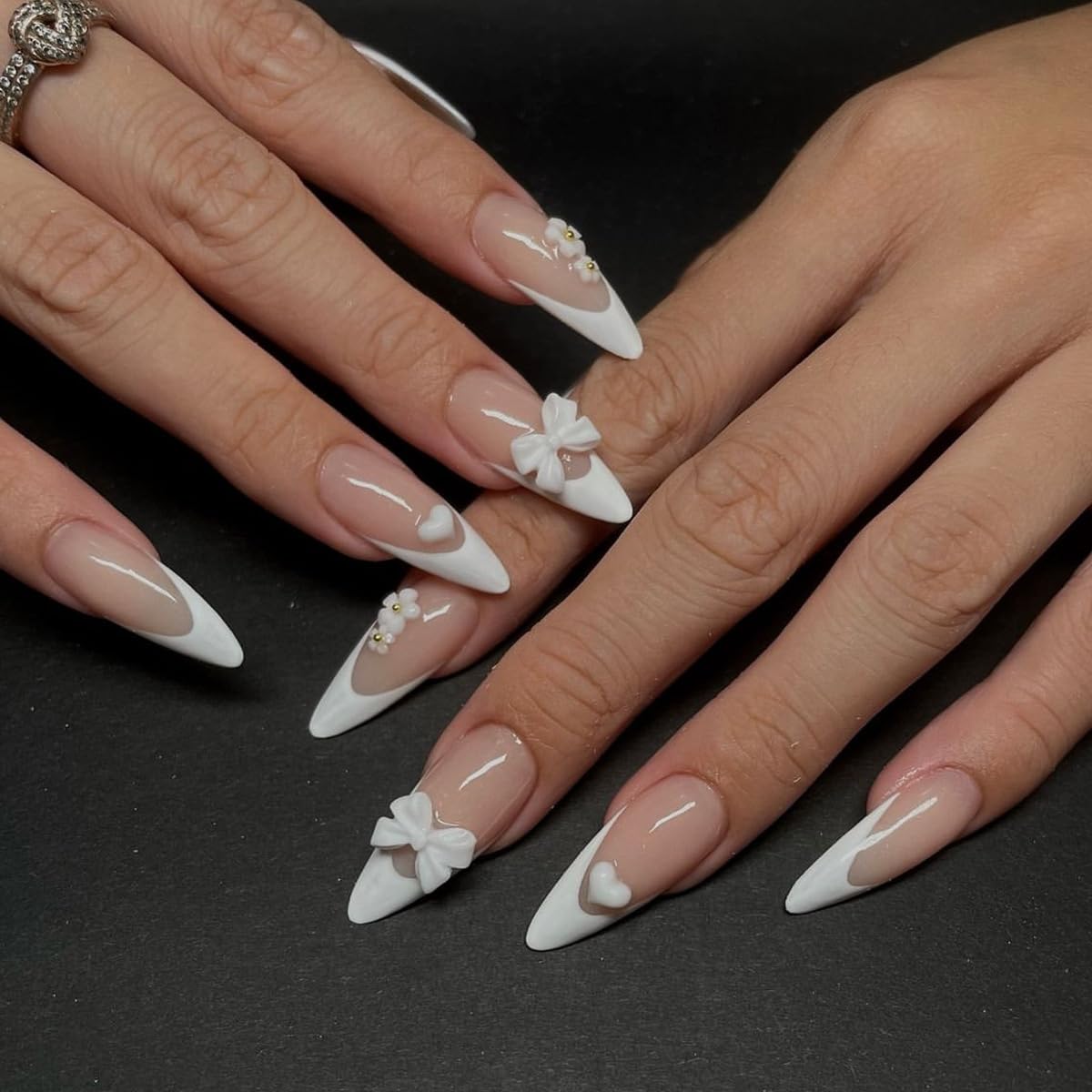 Photo 1 of 24 Pcs 5D Flower Press on Nails French Tip Press on Nails Medium Almond Fake Nails with Cute Charms Bow ? Heart Designs Glossy False Nails Nude Full Cover Stick on Nails for Women Girls Spring Nails