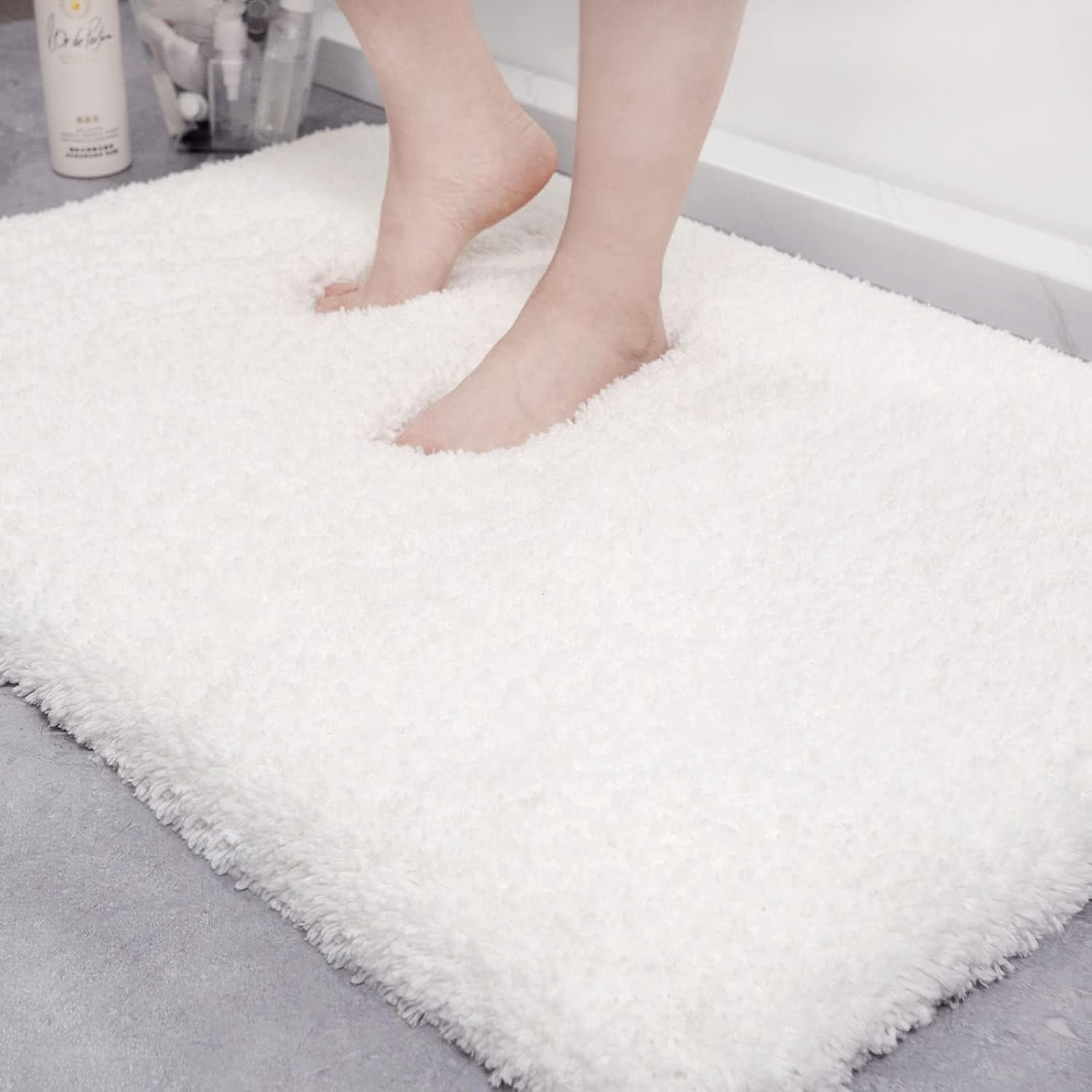 Photo 1 of ILANGO White Bathroom Rug Super Absorbent, Washable Bath Mat Non Slip for Floor, Microfiber Thick Plush Shaggy Bath Rug with Rubber Bottom for Bathtub Shower Room Sink, Extra Soft 24" * 35"