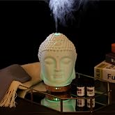Buddha Essential Oil Diffuser - Aromatherapy Diffusers for Essential Oils - White Ceramic Diffuser Buddha Head Humidifier with 4 Timer &amp; 7 Color Night Light Settings and Auto Off Function