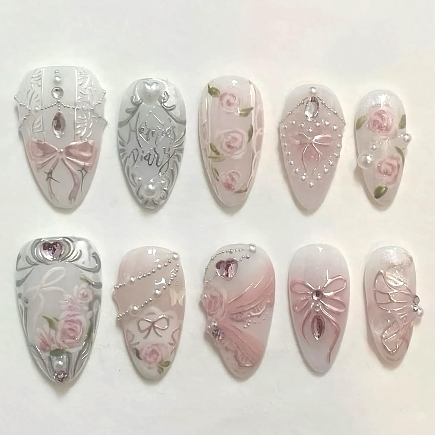 Photo 1 of 24Pcs Pink Bows Press on Nails Medium Almond Fake Nails Pink Rose Flower False Nails 3D Shiny Rhinestone Pearl Chain Press on Acrylic Nail Cute Bow Floral Stick on Nail Blush Glue on Nails for Women