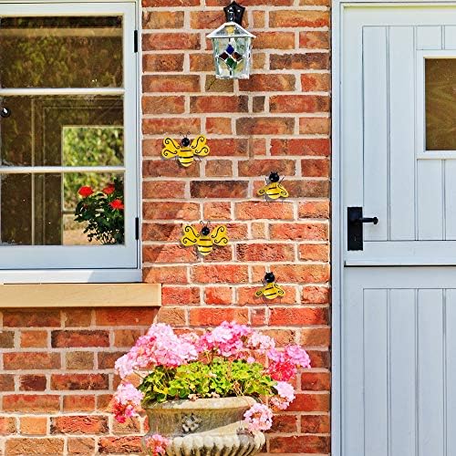 Metallic wall art set featuring bees in a backyard setting.