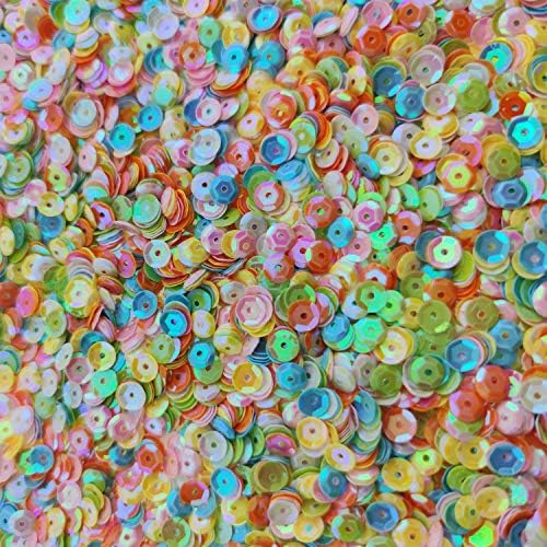 Colorful sequins in a cup for DIY projects.