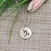 KUIYAI Zodiac Signs Cut Out Stainless Steel Disc Necklace (Capricorn)
