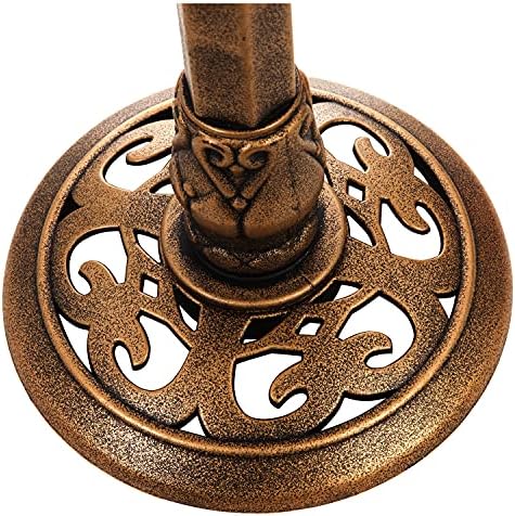 Evergreen backyard decor featuring a house and bird statue.