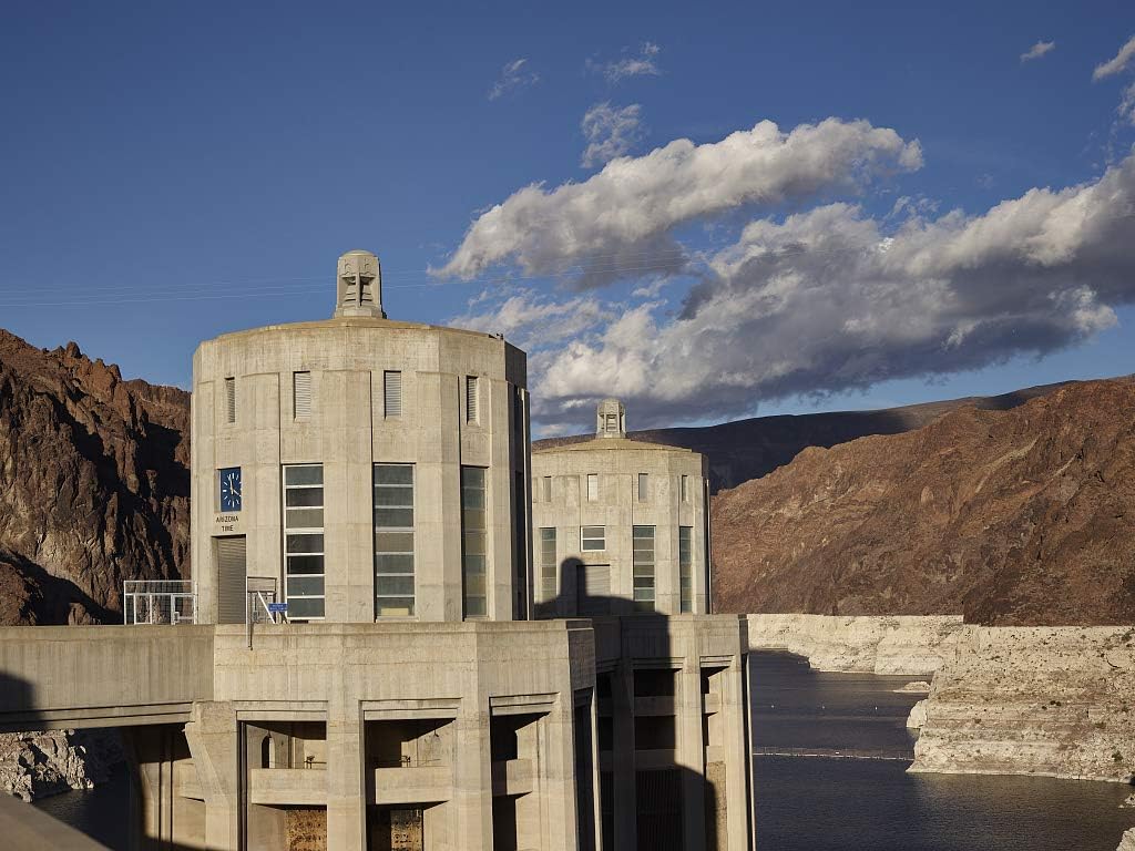 24 x 36 Giclee print of&nbsp;Two of four 338-foot-high intake towers that stand in the deep waters of Lake Mead behind massive Hoover Dam, which straddles the border between Arizona and Nevada in the 21l