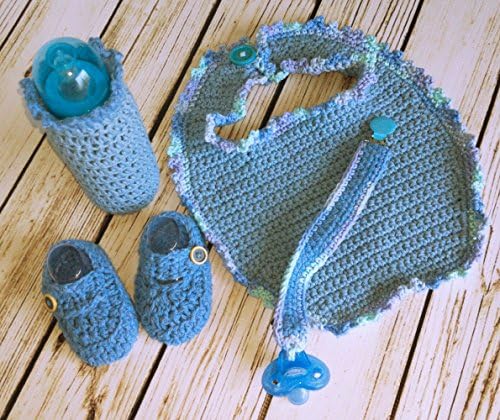 Just in time for Spring. Adorable baby gift set all in blue. Cotton and Acrylic yarns. Set includes bib, pacifier clip and pacifier, baby loafers, and baby bottle cover.