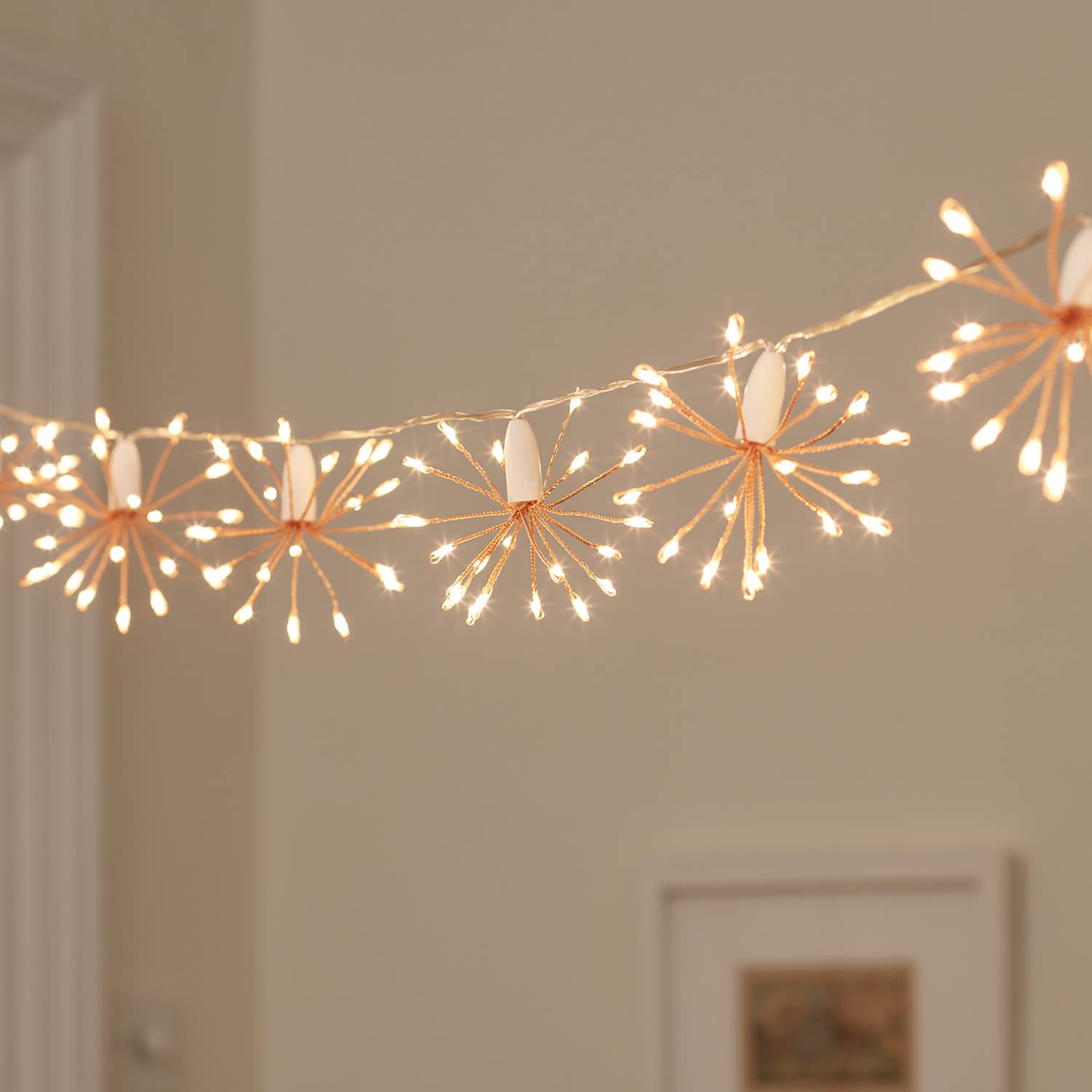 Lights4fun Rose Gold Starburst Chain Fairy String Lights with Timer 300 Warm White Micro LEDs Plug in for Indoor Use 3m