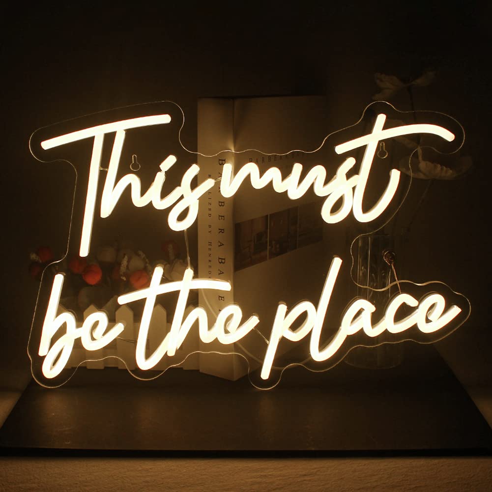 Photo 1 of This Must Be The Place Neon Sign Warm White Letter Led Signs for Wall Decor Usb Word Light Up Signs for Bedroom Salon Man Cave Beer Home Bar Wedding Birthday Party Decor Gifts