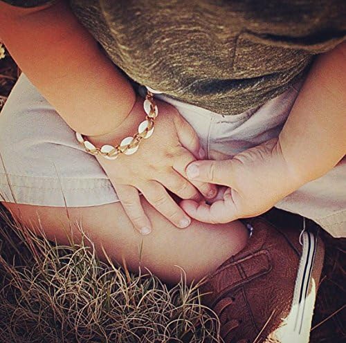 Comfortable keiki (child) puka shell bracelet with seafoam seaglass clasp
