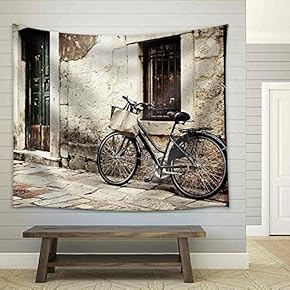 Bicycle with a Shopping Bag on Handle Bar, Left Beside Old Stone Wall - Fabric Wall Tapestry Home Decor - 51x60 inches