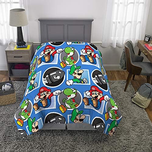 Super Mario themed comforter on a bed in a bedroom.