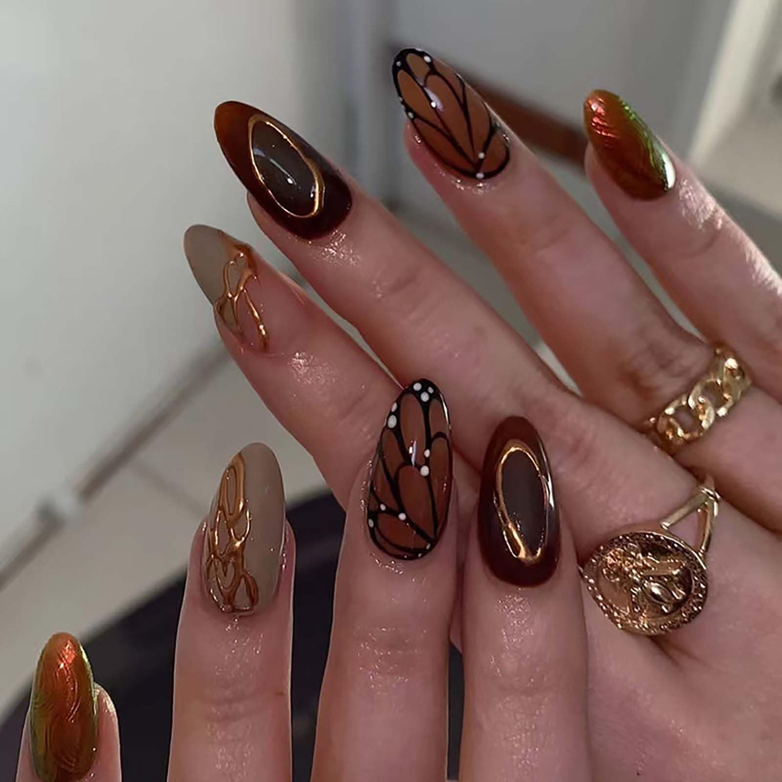 Photo 1 of QQPPOLIU Buttterfly Press on Nails Medium Almond Fake Nails Brown Press on False Nails with Butterfly and Striped Design Fall Nails for Women 24pcs