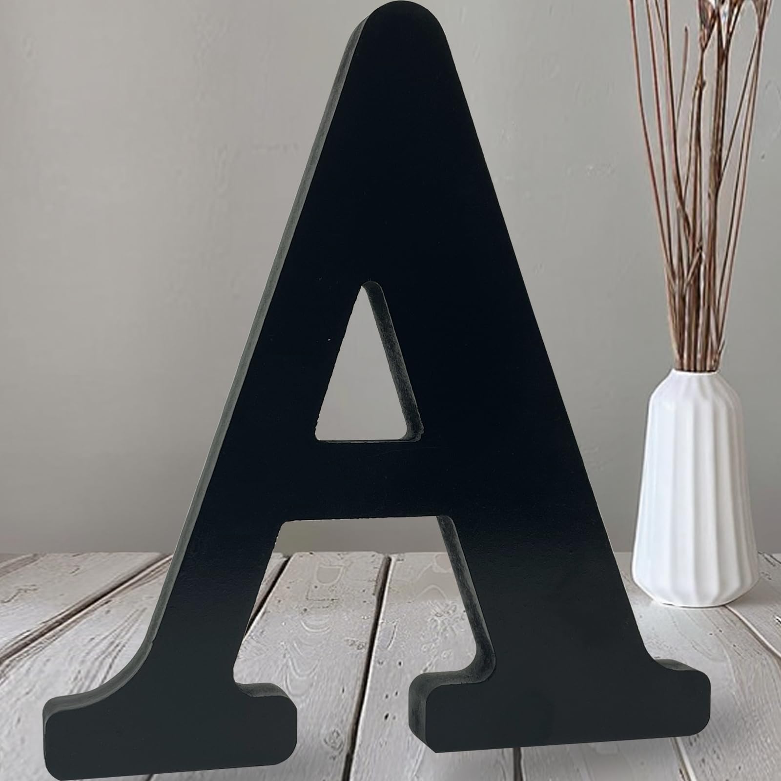 Photo 1 of AOCEAN 12 inch Black Wood Letters Unfinished Wood Letters for Halloween Decorative Standing Letters Slices Sign Board Decoration for Craft Home Party Projects (A)