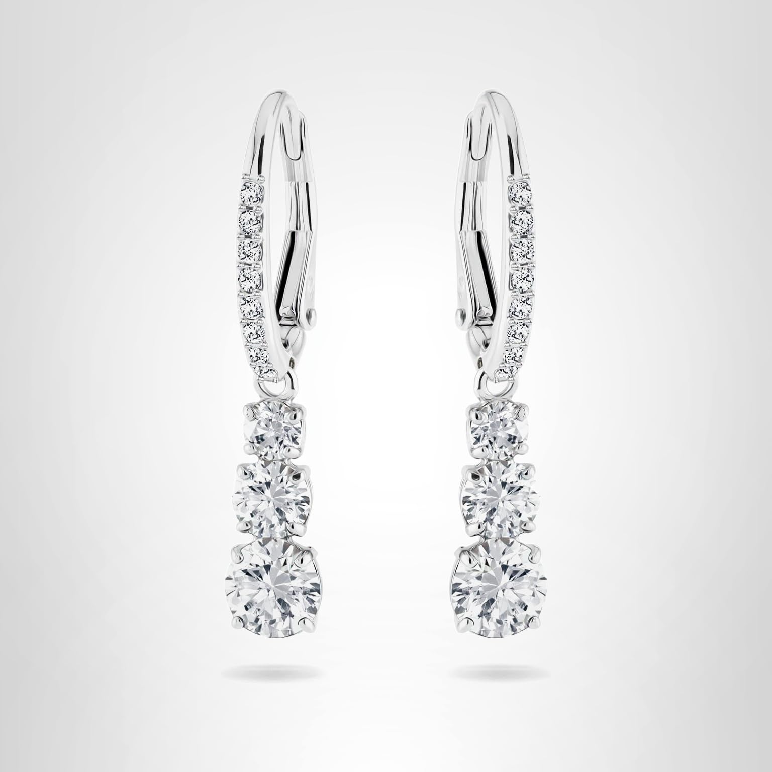 Swarovski Stilla Attract Trilogy Drop Pierced Earrings with White Crystals on a Rhodium Plated Setting with Hinged Closure