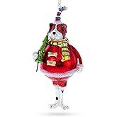 Dog in Fur Hat Holding Tree Glass Christmas Ornament