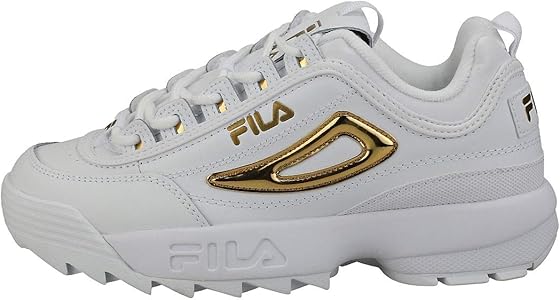 white and gold fila trainers