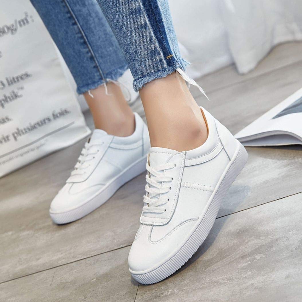 white flat trainers womens