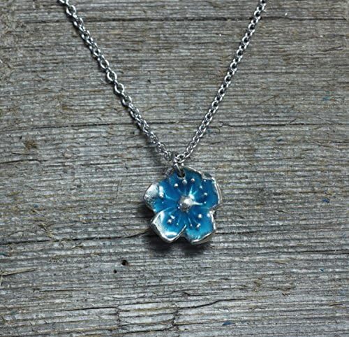 Flower blossom pendant necklace with blue glow in the dark