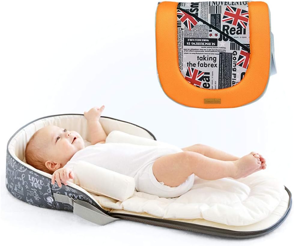 baby sleeping in travel cot