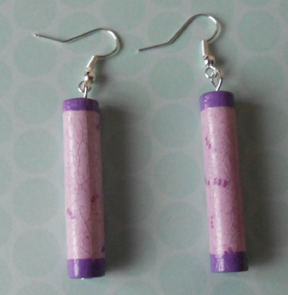 Earrings with handmade paper tube beads which are lilac patterned and dipped in purple acrylic paint.