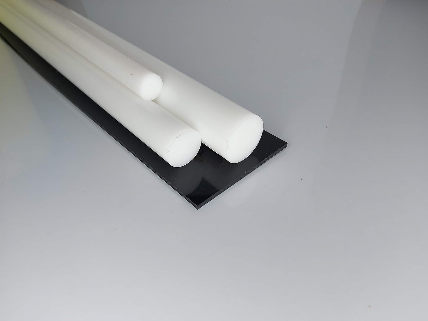 Barre tonde piene POM bianco naturale 65 mm lungo 250 mm