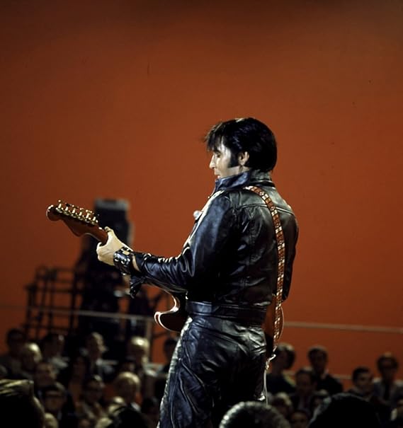 Amazon.com: Elvis Presley performing in a leather jacket and pants Photo Print (8 x 10): Home 