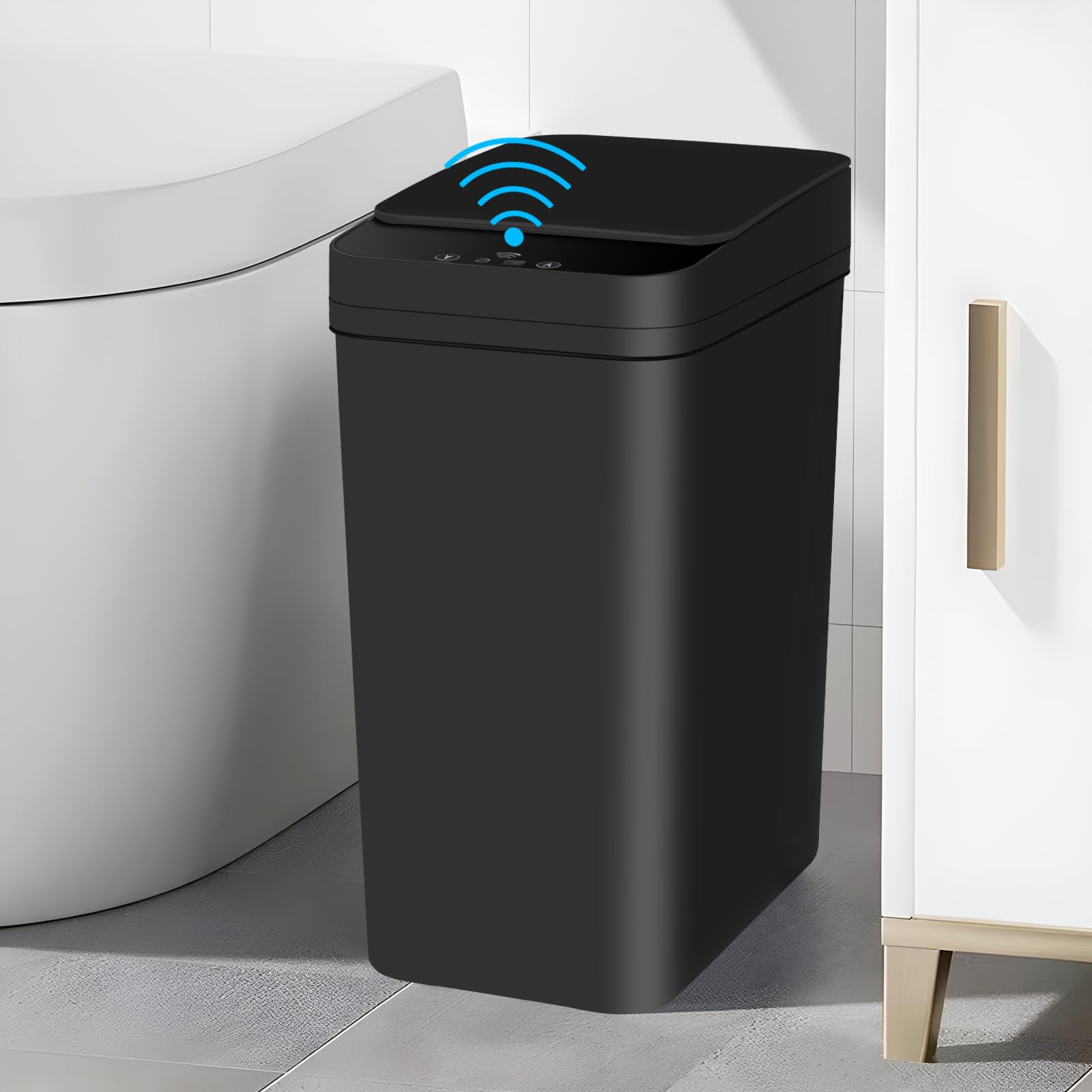 Black touchless sensor trash can in a modern bathroom