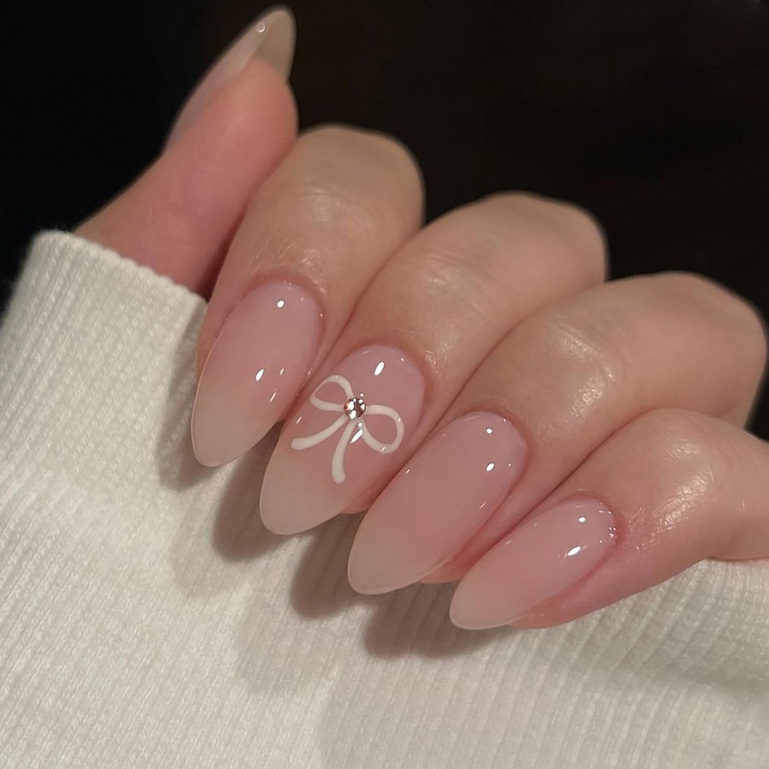 Photo 1 of Light Pink Press on Nails Short Almond Fake Nails Glossy Solid Color Full Cover False Nails Design with White Bows Stick on Nails Nude Acrylic Nails for Women Girls Nail Art Decorations 24Pcs