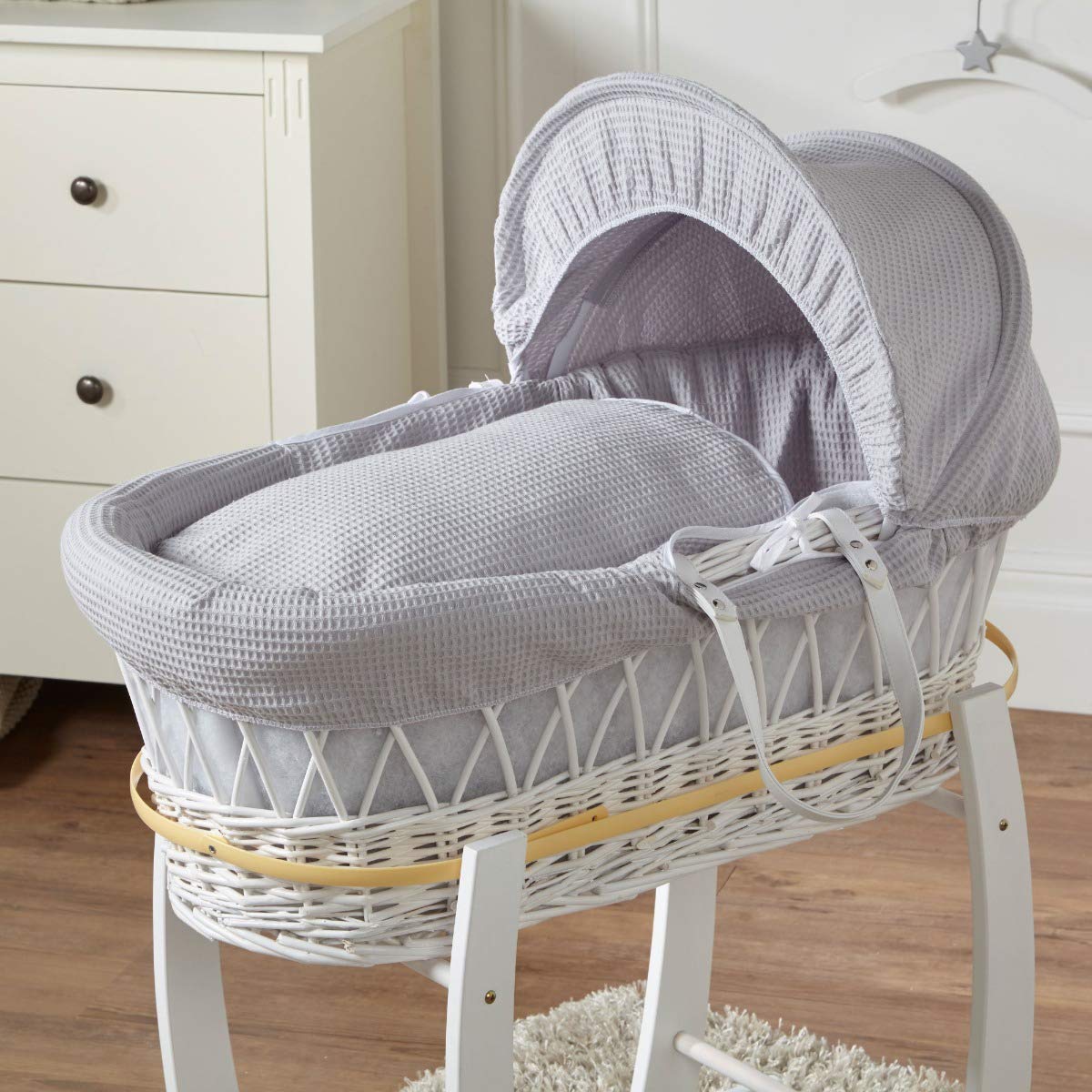 grey and white moses basket and stand