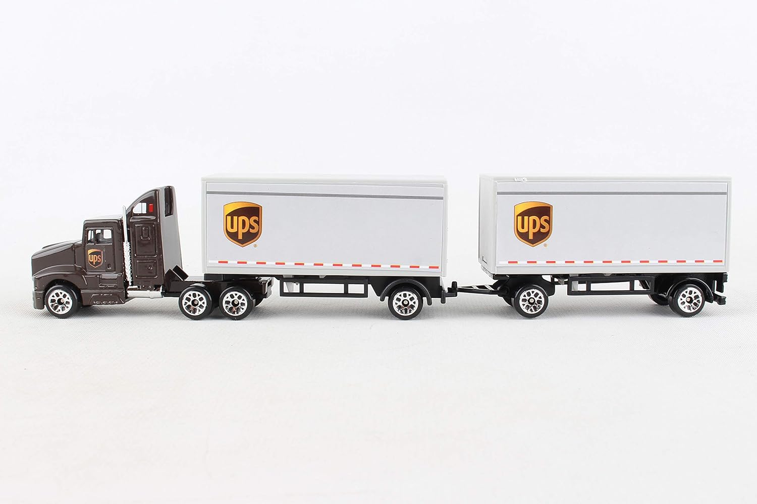 Amazon Com Daron Ups Die Cast Tractor With 2 Trailers Toys Games
