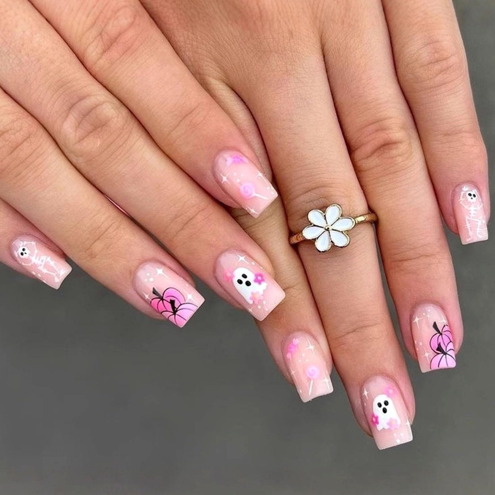 Photo 1 of Halloween Press on Nails Medium Square Fake Nails with Pumpkin Skeleton Ghost Dot Designs Glossy Glue on Nails Press ons Pink Full Cover Halloween Stick on Nails for Women Girls 24 Pcs