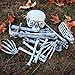 Halloween Haunters 18 Piece Bag of Skeleton Bones with Screaming Laughing Skull Prop Decoration - Flashing Bloodshot Eyes, Graveyard Human Body Part Set