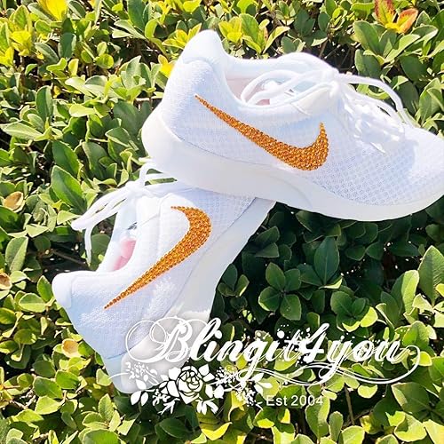 white nike shoes with orange swoosh