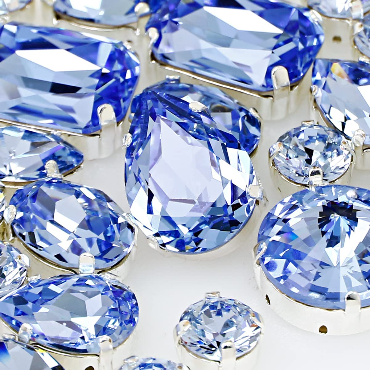 DONGZHOU Sew on Rhinestones, 82 Pcs Crysta Rhinestones Glass Sewing Gemstones with Silver Prong Setting for DIY Crafts Jewelry Making Clothing Wedding Dress Decoration, Light Blue