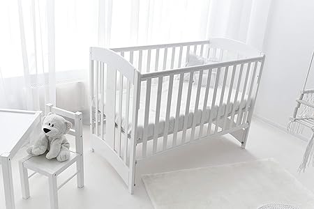white wooden cot bed
