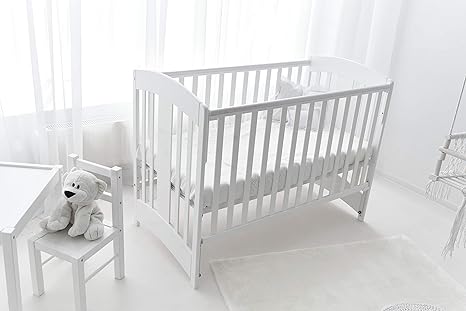 white and wood cot