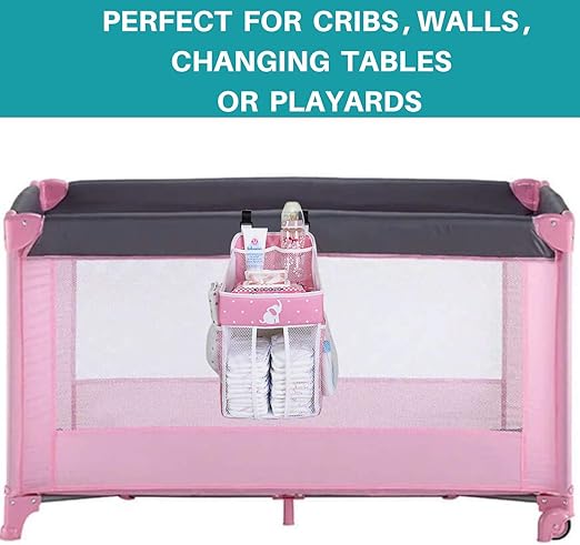 pink crib with changing table