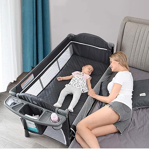 bassinet that sits on bed
