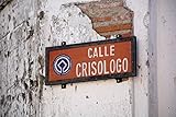 Low angle view of street sign Calle Crisologo Vigan