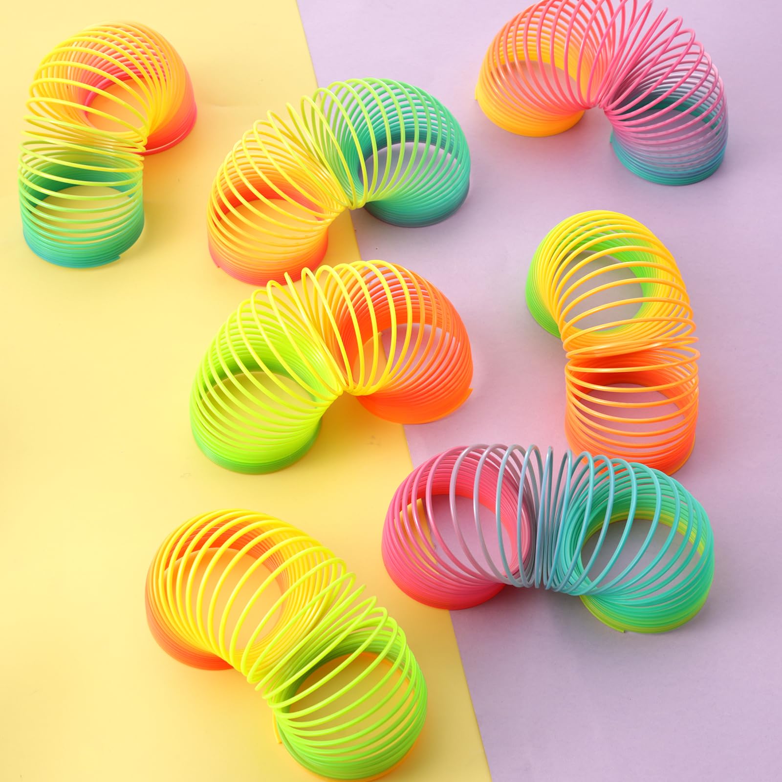 JOHOUSE Rainbow Magic Spring Party Favors for Kids, 12 PCS Colorful Plastic Spring Toy, Treasure Box Toys for Classroom, Fun Goodie Bags Stuffers for Kids Birthday