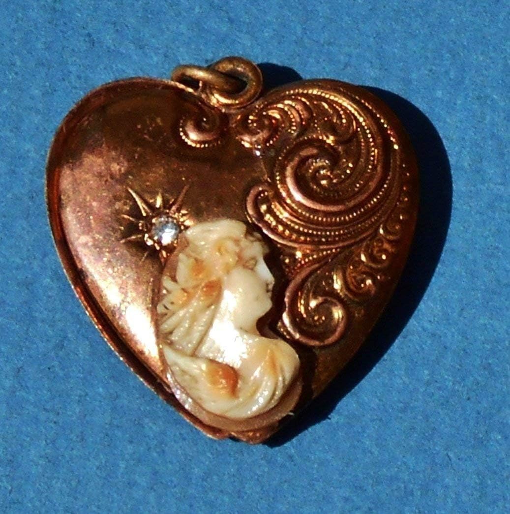 Antique Filligre Habille Heart Copper Locket Coupled with Antique Hand Carved Shell Cameo of"Eos" with Wings Heart Habille Locket Pendant