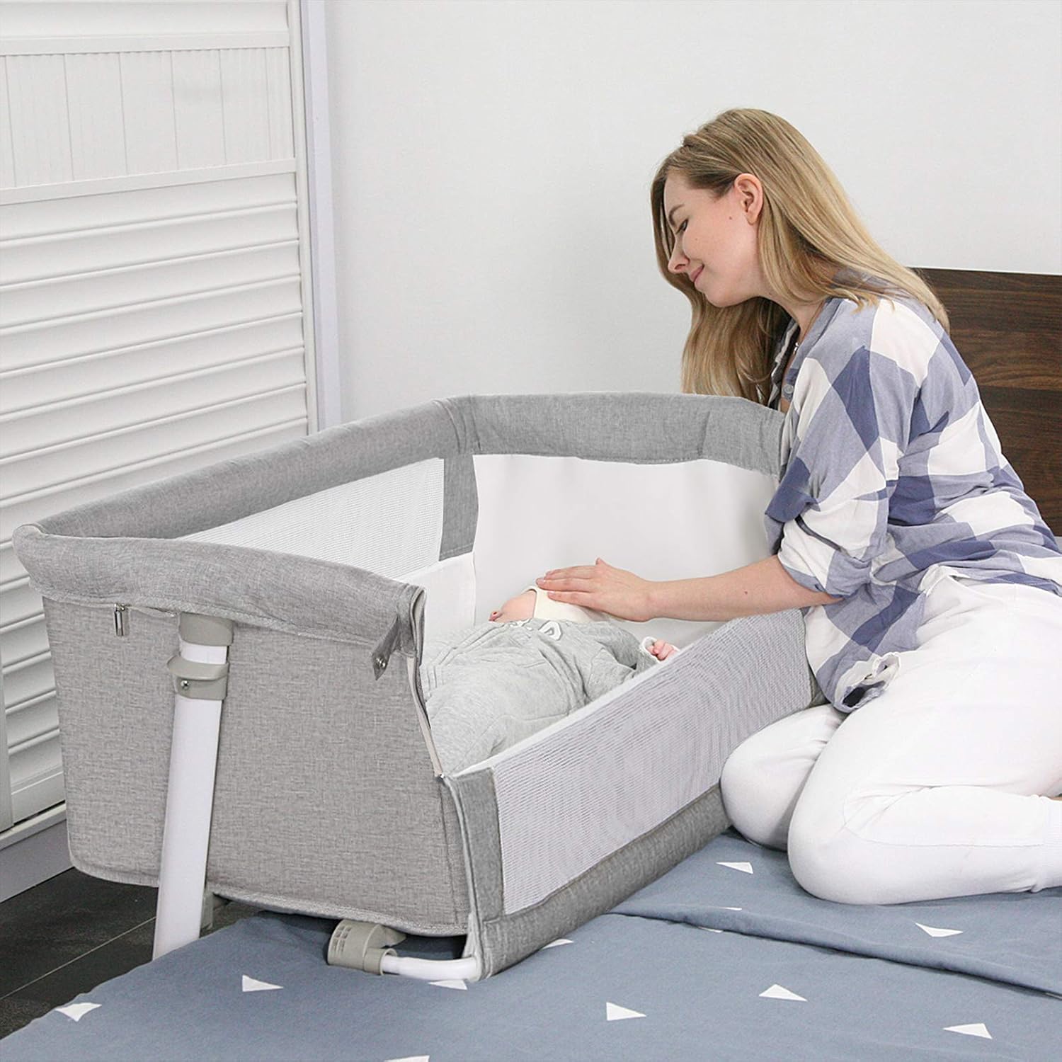 bassinet that sits on bed