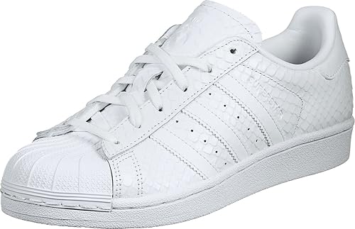 white adidas with pink stripes