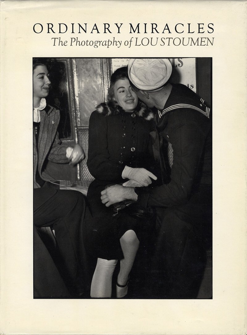 Cover Art for the book Ordinary Miracles: The Photography of Lou Stoumen, showing a naval serviceman embracing a woman.