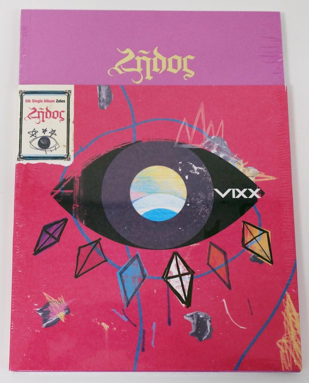 VIXX - Zelos (5th Single Album) CD + 68p Photobook + Photocard + Folded Poster + Sticker + Vixx Postcard + Extra Gift Photocard